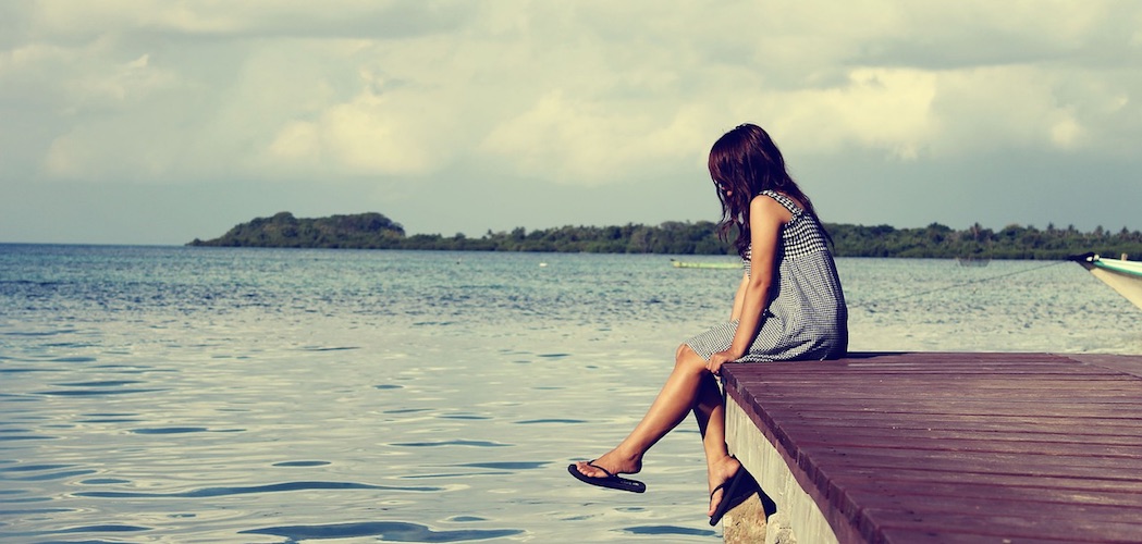 Girl reflecting on the dock