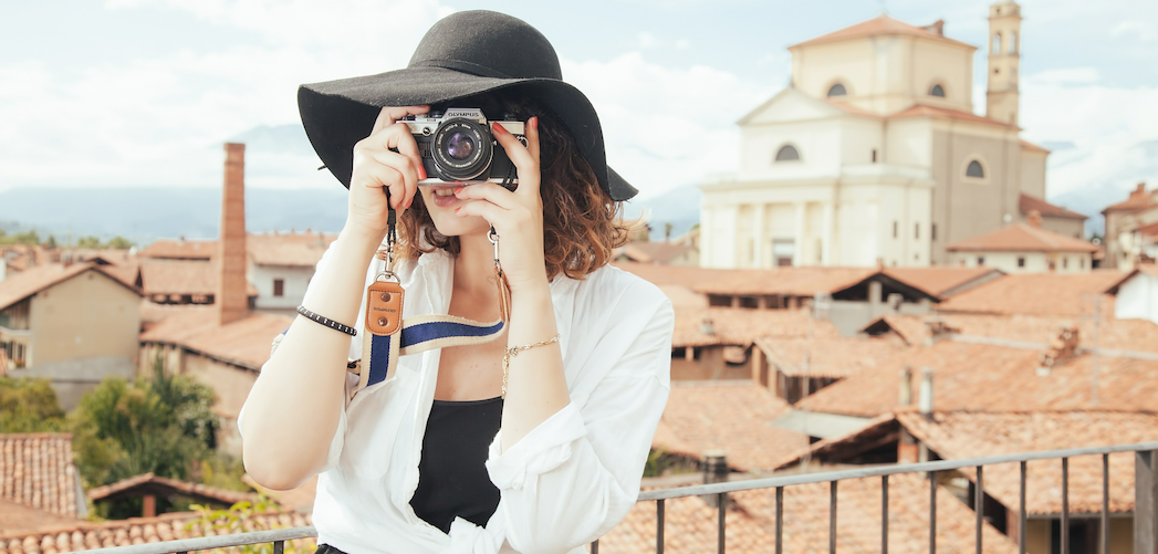 woman taking photographs travelling