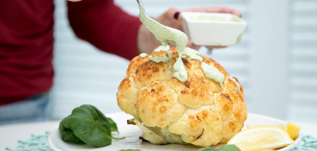 When whole roasted cauliflower meets basil-infused tahini, something magical happens! The flavors in this simple dish will wow a crowd. Get the recipe!