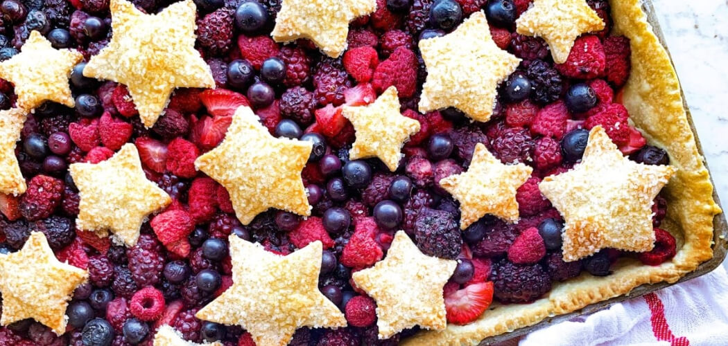 This Mixed Berry Slab Pie recipe by Michelle, blogger behind Michelle Sips & Savor, is the perfect addition to your July 4th menu! Get the recipe.